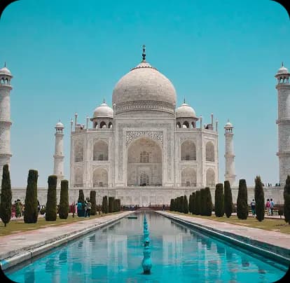 Taj Mahal reflected in water under a clear sky